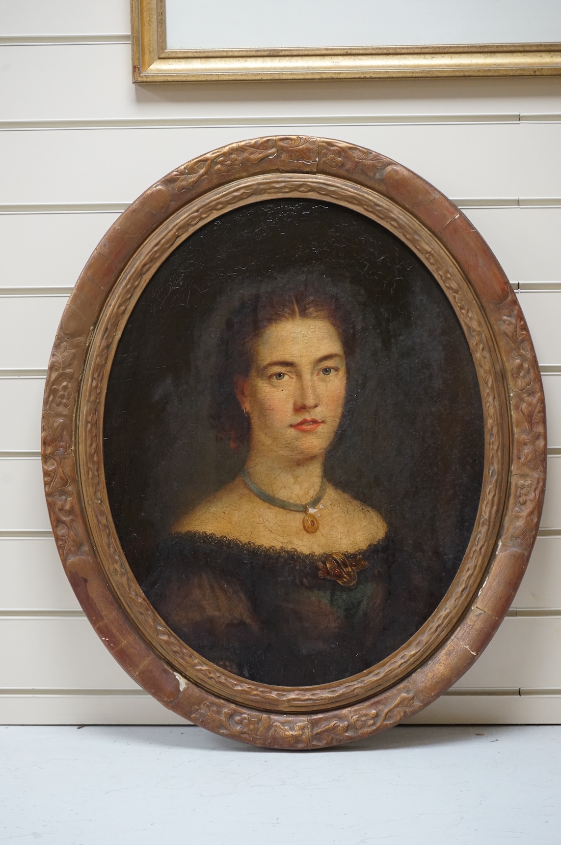 Late Victorian School, oval oil on board, Head and shoulders portrait of a young lady, unsigned, 58 x 45cm